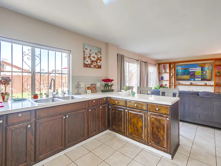 Sit or grab a drink on the spacious kitchen island as you keep the chef company