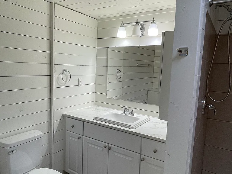 New cabinets and countertop in bathroom