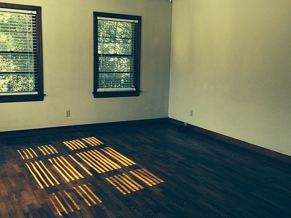 Living room with ceiling fan and beautiful hardwood floors