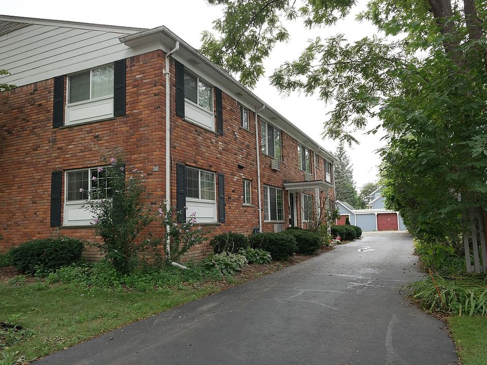Driveway entrance on North side and alternate method is through the short alley in rear of building.