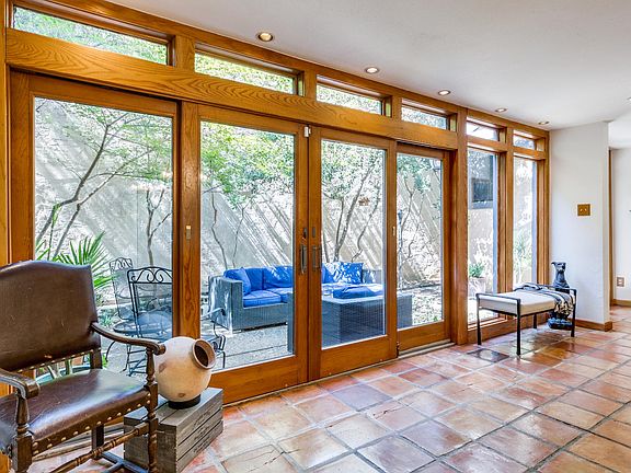 Gorgeous floor to ceiling glass doors and windows with calming view of your courtyard.
