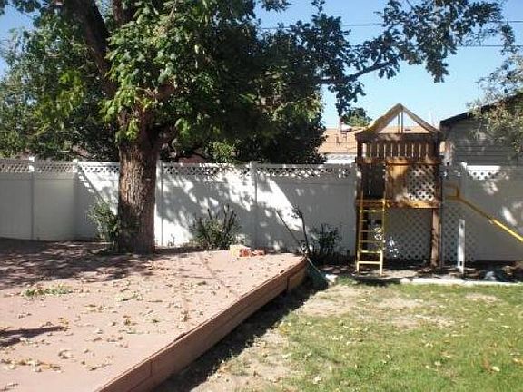 Fenced yard w/playset