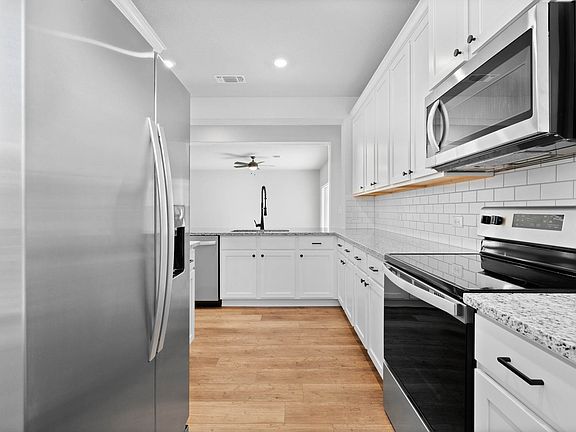 The kitchen has energy-efficient appliances.