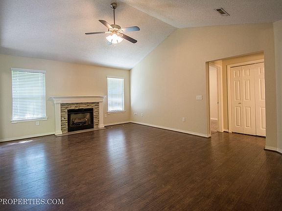 Living Room. Vaulted Ceiling. Wood Floors.