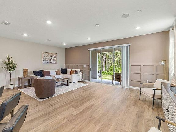 Downstairs, enjoy a sunny open-concept living area - Birch townhome by Highland Homes