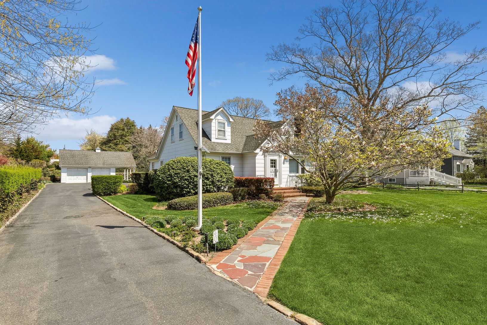  Front exterior.  Large driveway with turn around