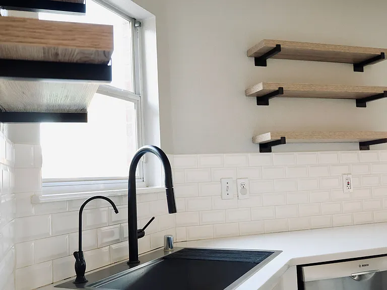 Kitchen view. Quarts counter tops an all kitchen area