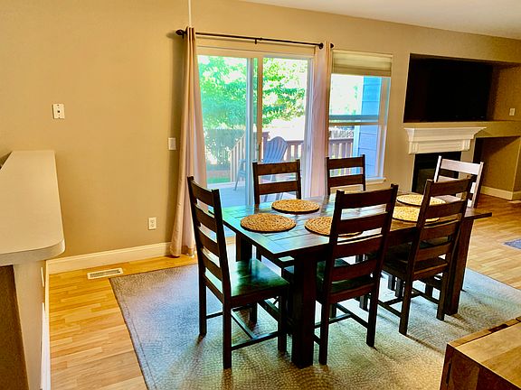 Dining - room for bar seating also; adjacent to HUGE back patio