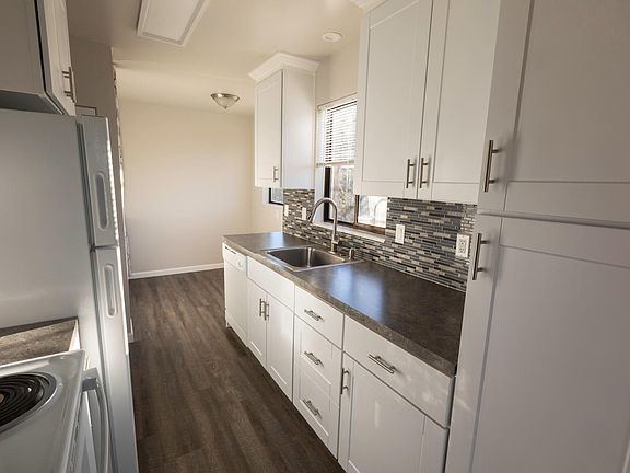 Kitchen with breakfast nook in back