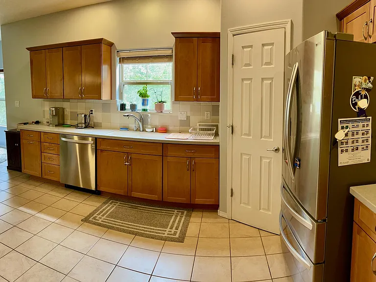 Spacious kitchen with high-end appliances & ample pantry, cabinet space