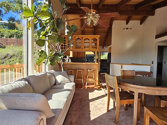 Great room. Perfect for additional seating and dining. Photo view facing kitchen. Note: View is panaramic.