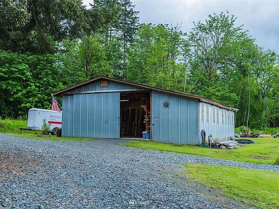 50X30 shop with electricity and a wood stove. A water spigot is right out the door.