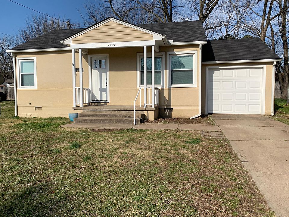 Front with energy efficient front door and windows. Garage with auto opener.