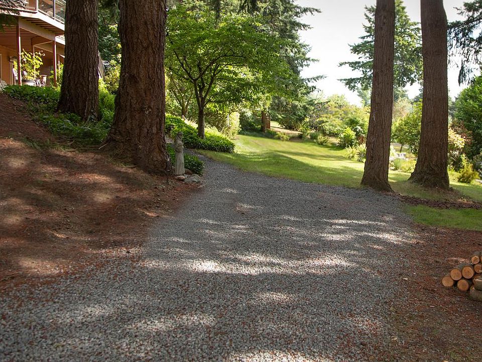 Gravel parking area and to the left is the walkway up to the apartment.