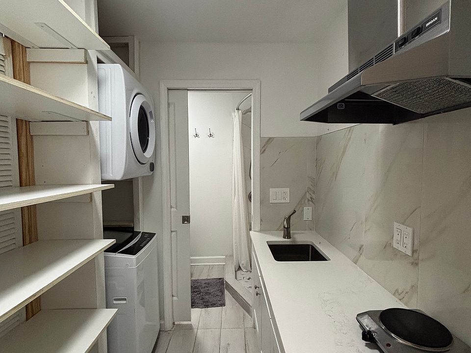 Kitchennet with large selves for huge pantry storage space.
