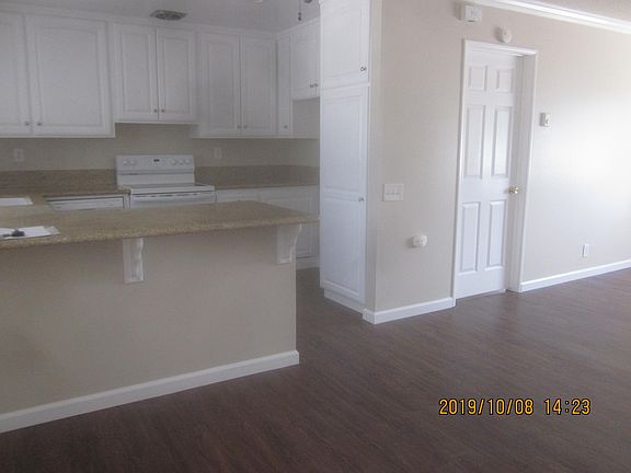 Open kitchen area (to living-dining room) showing counter for stools, if desired