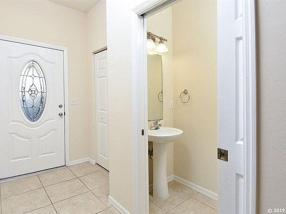 Entry Foyer with Coat Closet and Half Bath.