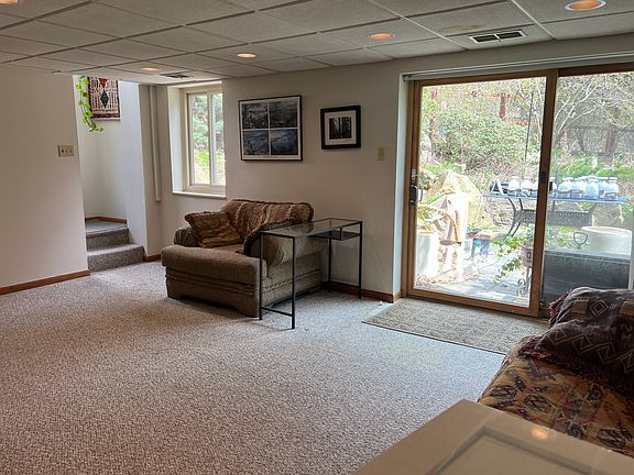 Sliding glass doors onto patio shared with owner. A interior door with a lock is being installed at the bottom of the steps for privacy and security.