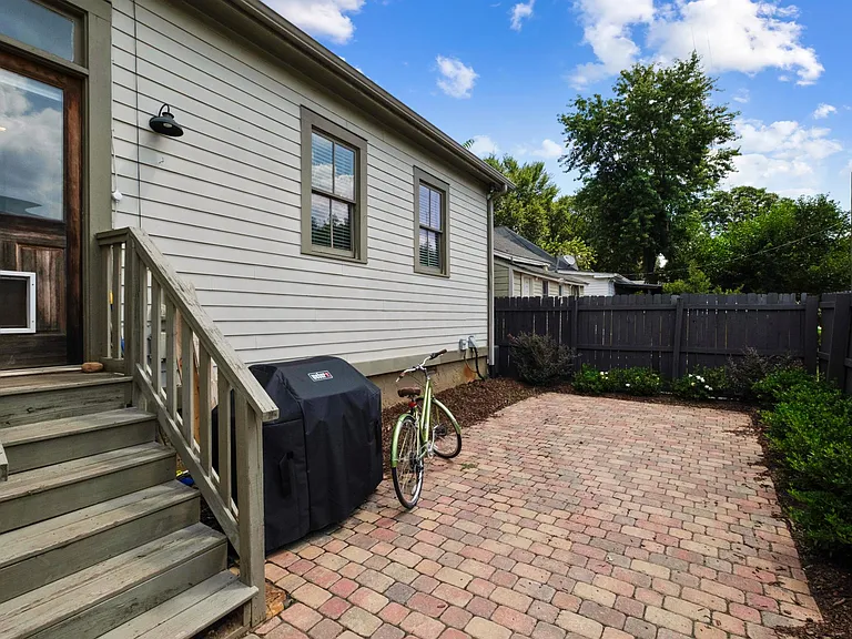 Backyard patio/parking area. Rare to have off street parking in Cabbagetown!