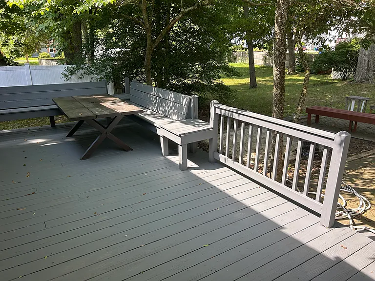 view of the rear deck from the sunroom