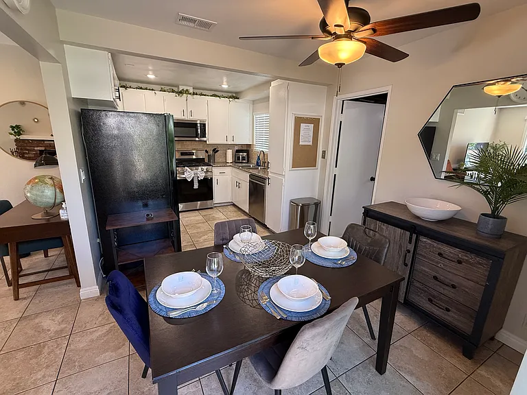 Dining room with adjacent kitchen and living room on the left