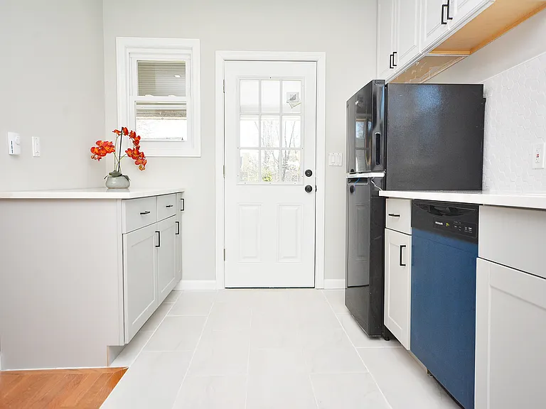 Kitchen - back door to private porch and back yard.