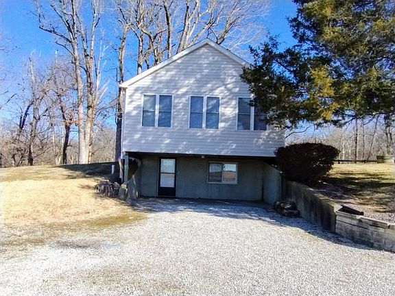ALL THE UPPER WINDOWS THAT YOU SEE ARE THE UPPER SUNROOM. BELOW IS THE WALKOUT BASEMENT TO THE COVERED PATIO.