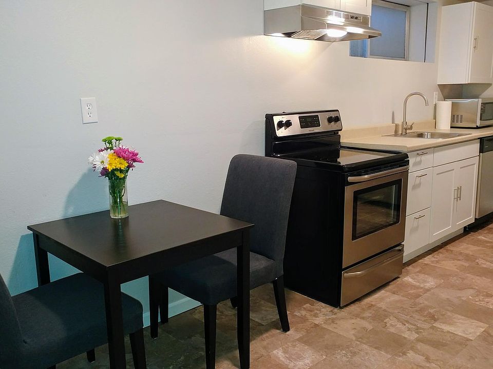 Kitchen w/ stainless steel appliances.