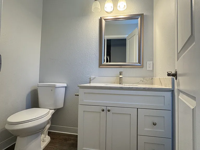 Downstairs half bathroom updated with new sink and vanity.