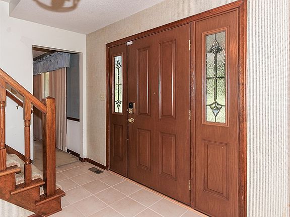 Newer carpet and tiled entry