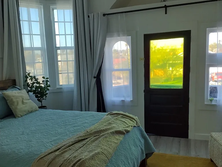 Bedroom with balcony door closed