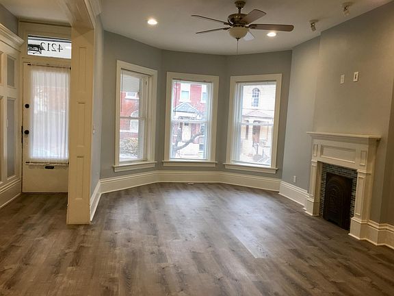 Living room, view towards front entry on left