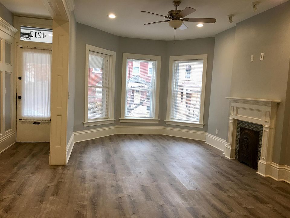 Living room, view towards front entry on left