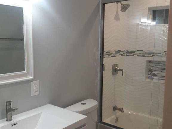 Second Bathroom with bathtub with glass enclosure