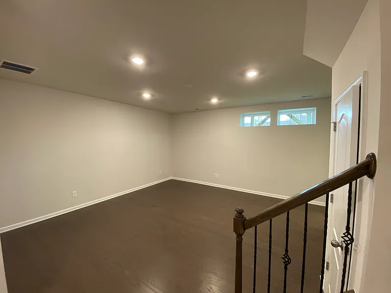 lower level bedroom and stairs going up.