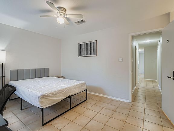 Queen-sized bed and property hallway