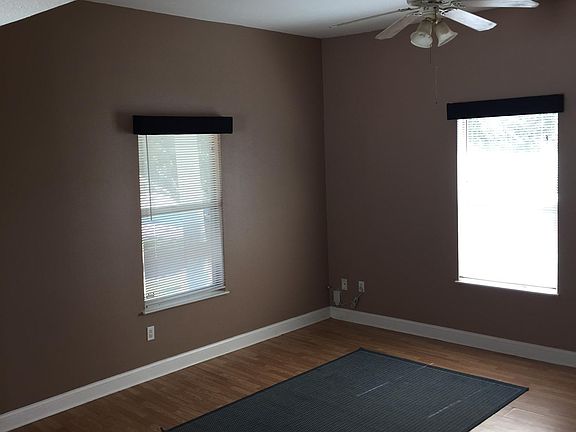 Spacious living room with plenty of light. Wood flooring