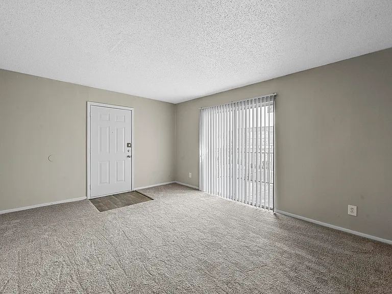 Spacious living room areas with patio sliding door.