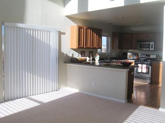 Walkout to deck from family room and view ito kitchen.