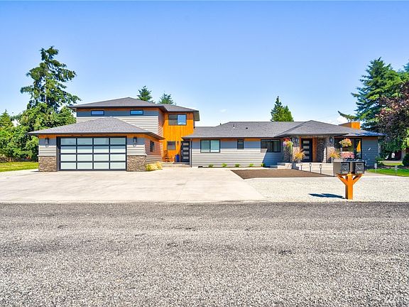 Beautiful Anderson Construction Custom Remodel - NW Contemporary, 3 bedroom 3.5 bath home is breathtaking inside and out! This home is located in a friendly Burlington neighborhood close to all amenities.