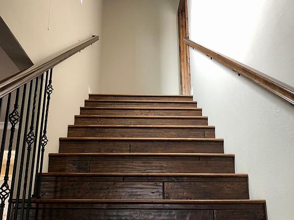 Stairs to master bedroom/attached bath