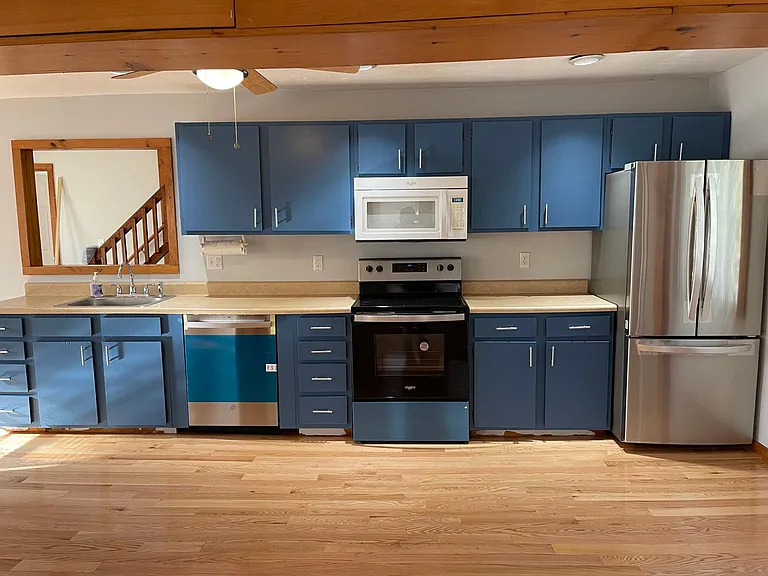 New appliance and updated cabinet in kitchen