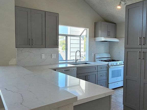 Quartz breakfast bar with extra outlets for charging or laptops!
