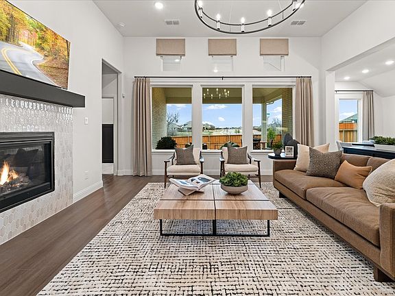 Westlake II one-story floor plan featuring open living spaces, a game room, covered patio, and a pri