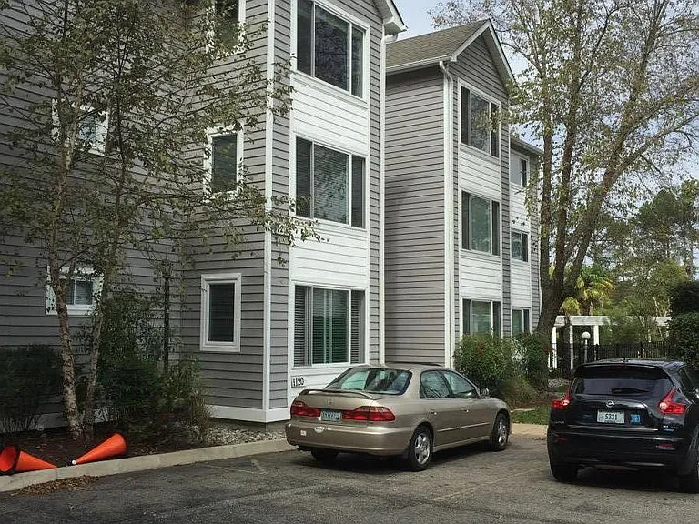 Exterior Of Building. Ample, off-street parking, makes it easy for you and your guests to access your new luxury Condo!