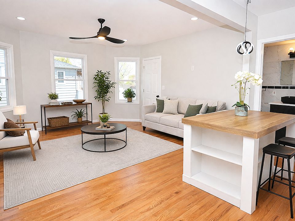 Virtually staged living room. Open floor plan to the kitchen.
