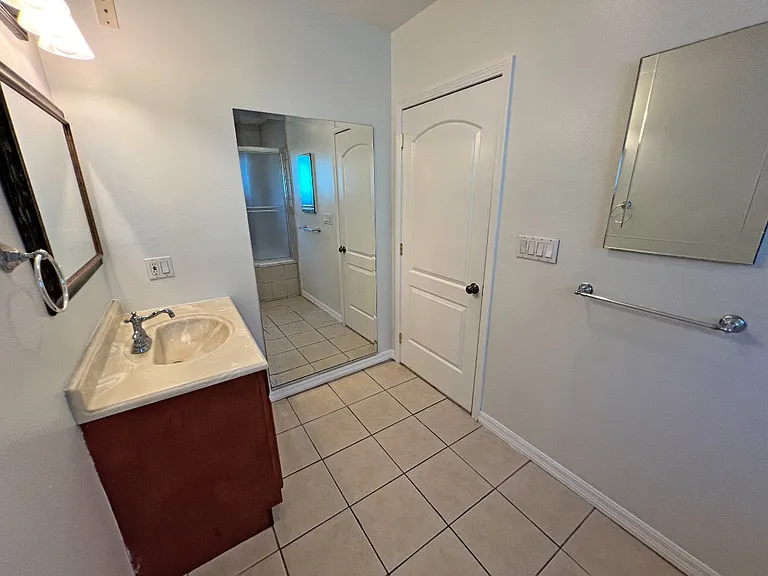 Primary bathroom with large fashion viewing mirror.