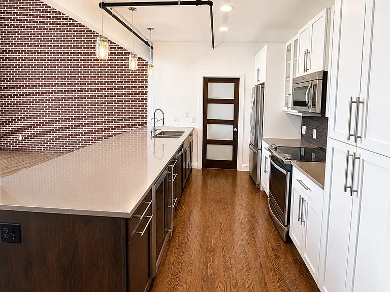 Additional kitchen view overlooking the main living space.