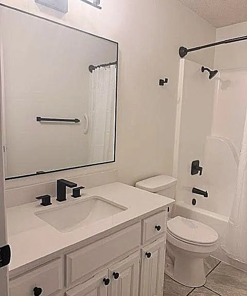 Main hallway bathroom with tub and shower