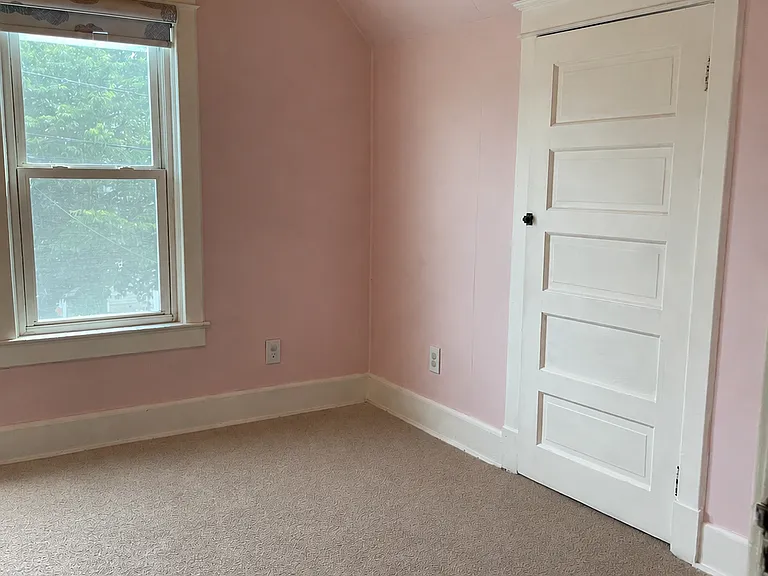 Comfortable upstairs bedroom with a closet, ceiling fan, carpeted flooring, and a cozy layout that can work well as a bedroom, guest room, or home office.
